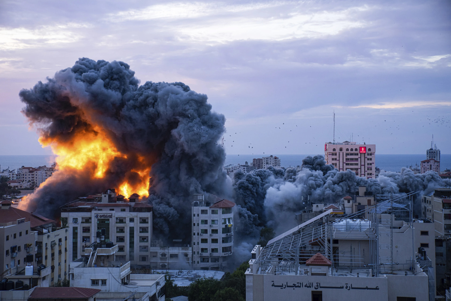Hezbollah and Israel exchange fire as Israeli soldiers battle Hamas the day after a surprise attack