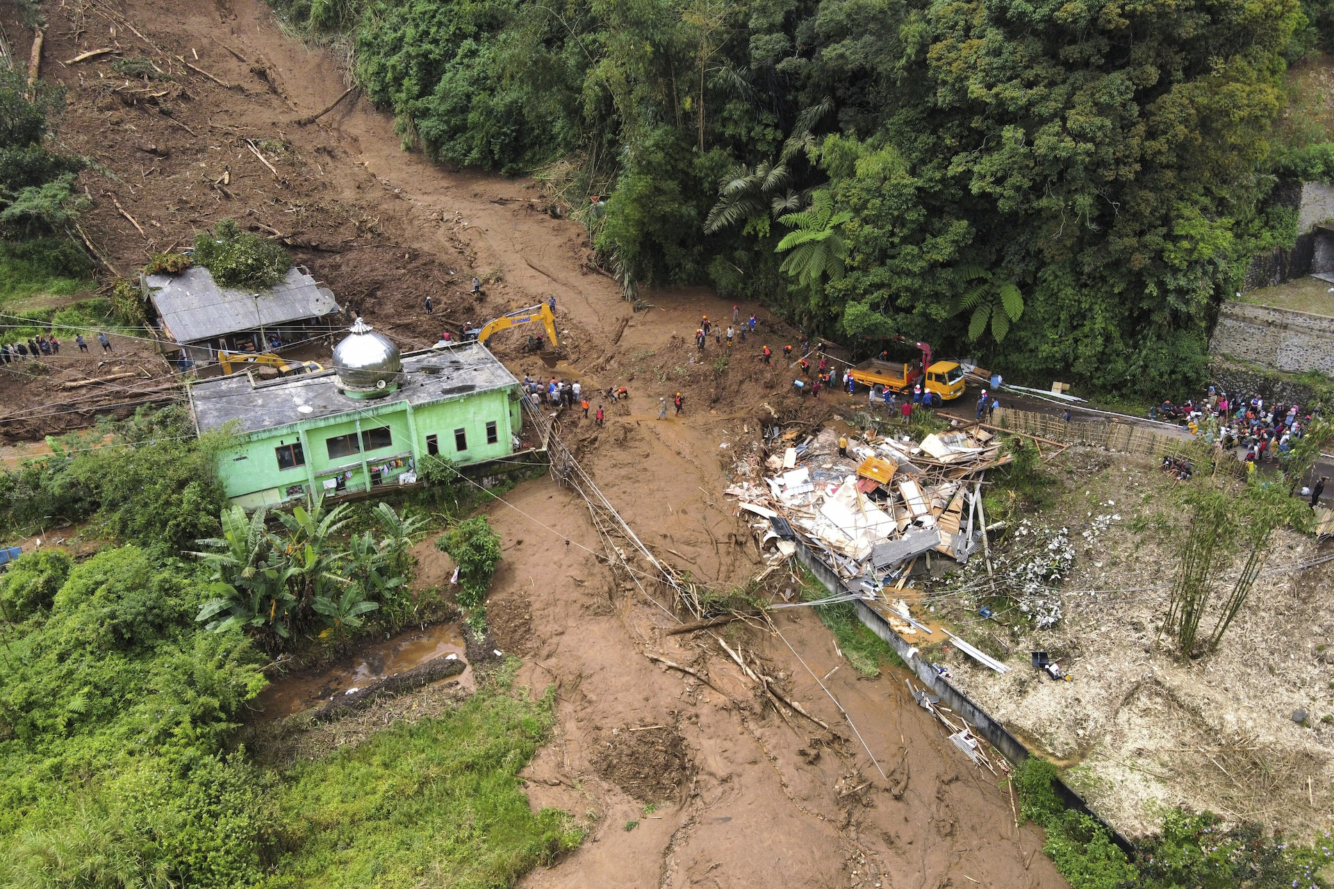 16 dead and 6 others missing in a landslide and flash floods in Indonesia's Sumatra island