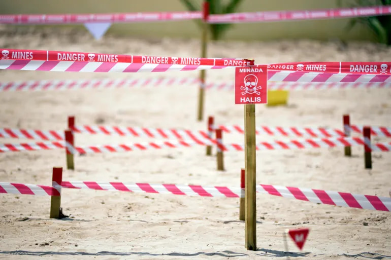 At least 27 dead after coming in contact with an explosive device in a football field