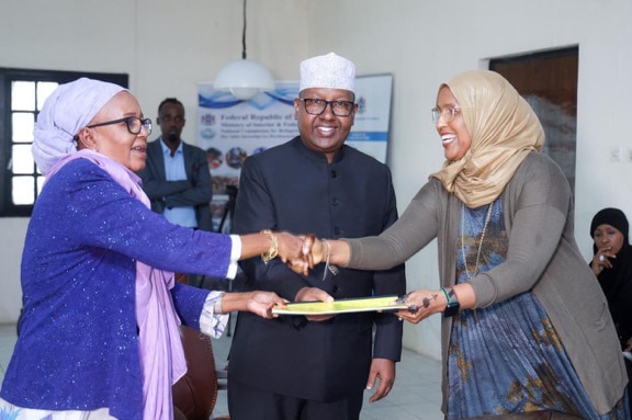 New chairperson of the National Refugee Agency takes over from her predecessor