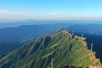 Wind power turbines line a mountain range in Ji’an, Jiangxi province, July 9, 2022.